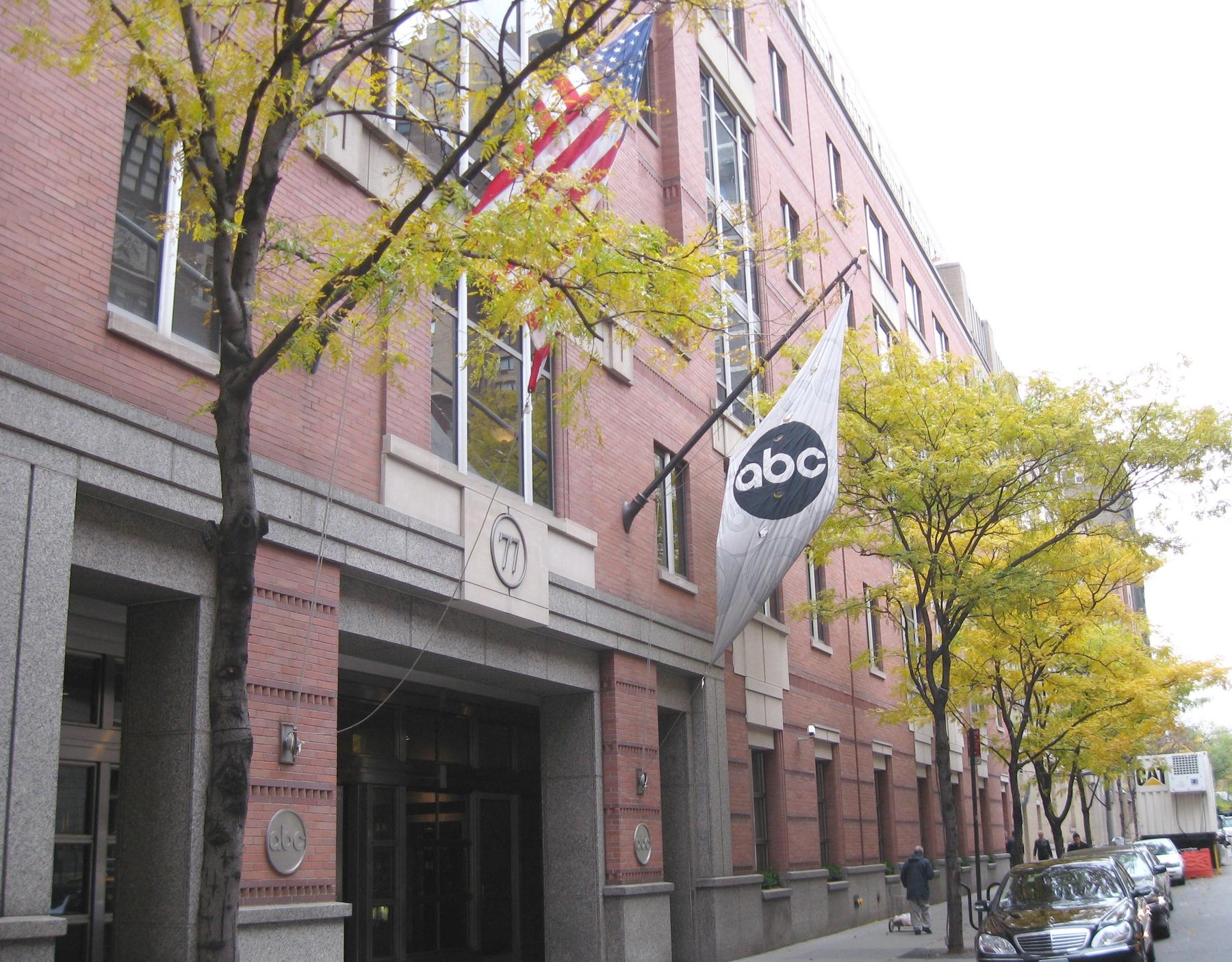 ABC News headquarters at 77 West 66th Street in Manhattan, with an American flag and an ABC banner on the facade