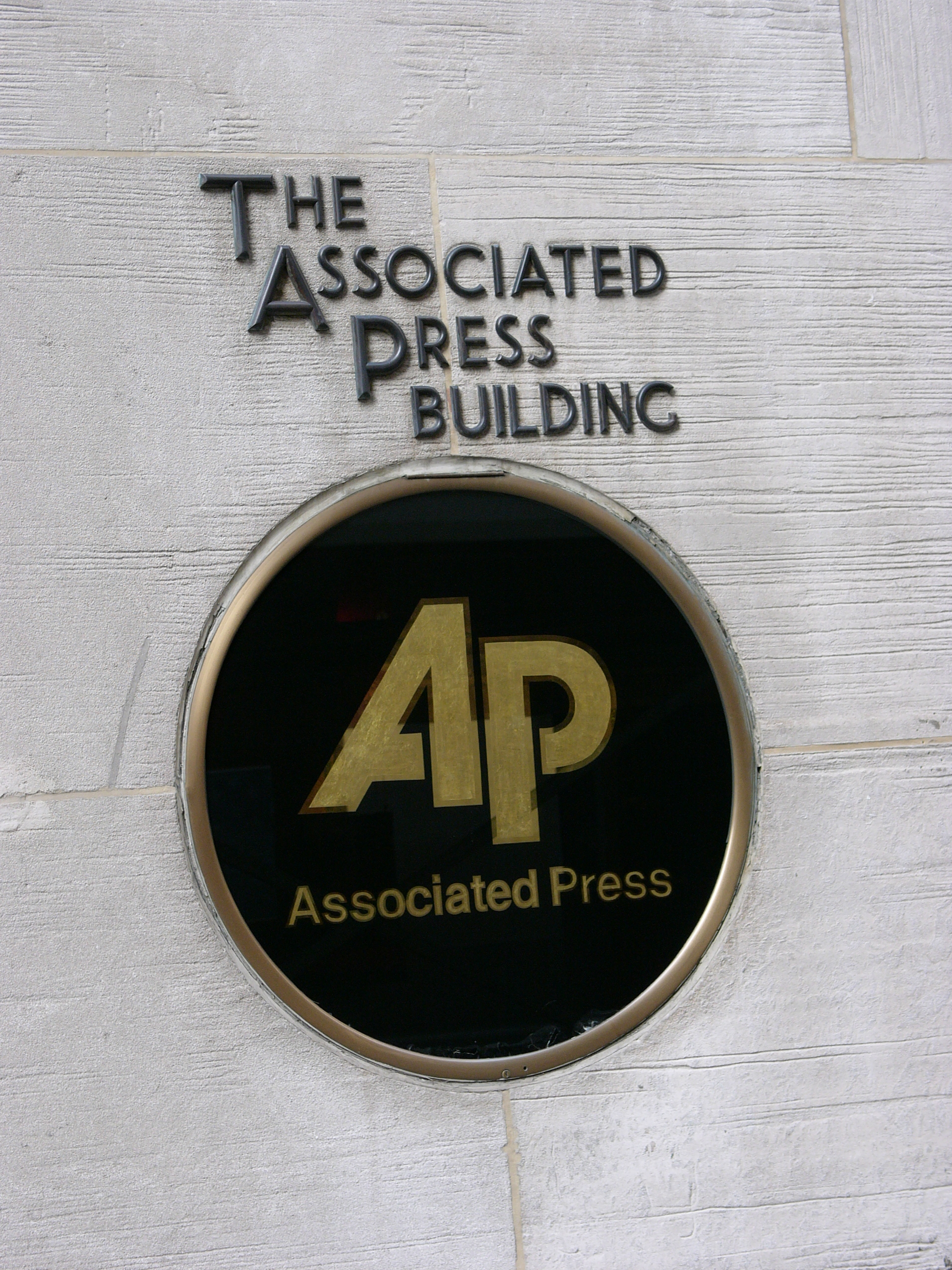 The Associated Press building sign in New York City, featuring the Isamu Noguchi AP plaque