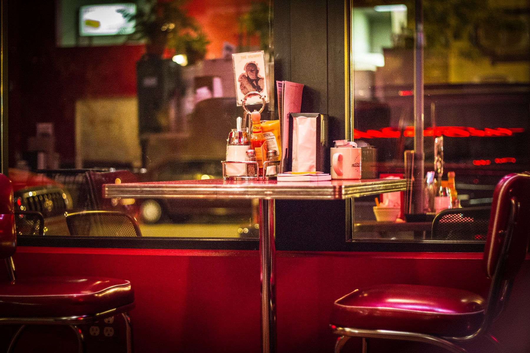 Interior booth and table at The Bad Waitress coffee shop and diner in Minneapolis, Minnesota