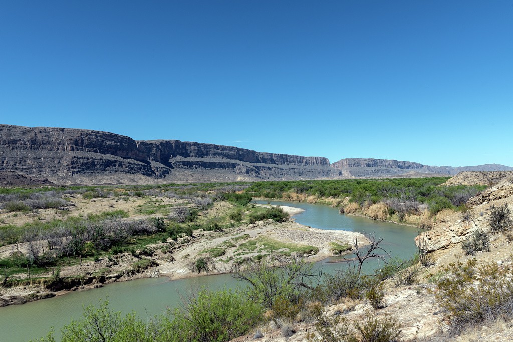 The Rio Grande winding below cliffs in Big Bend National Park, Texas