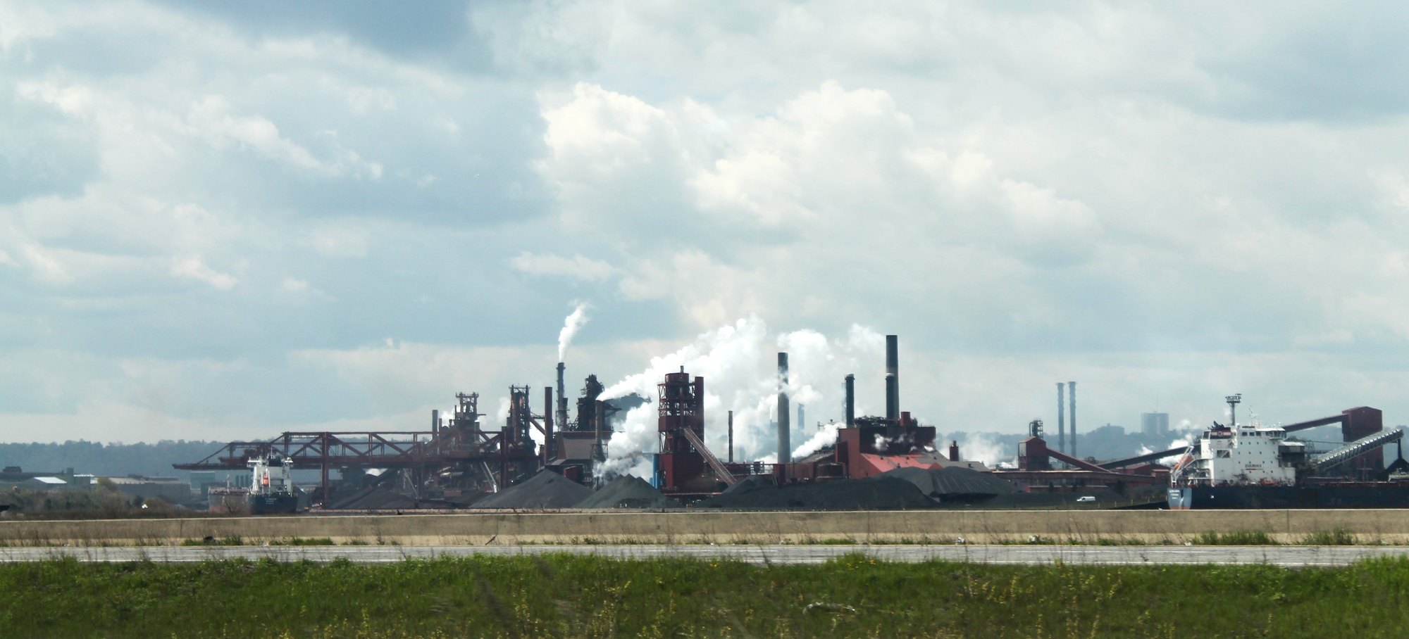 Blast furnaces, smokestacks and lake freighters at the steel mills on the Hamilton, Ontario waterfront