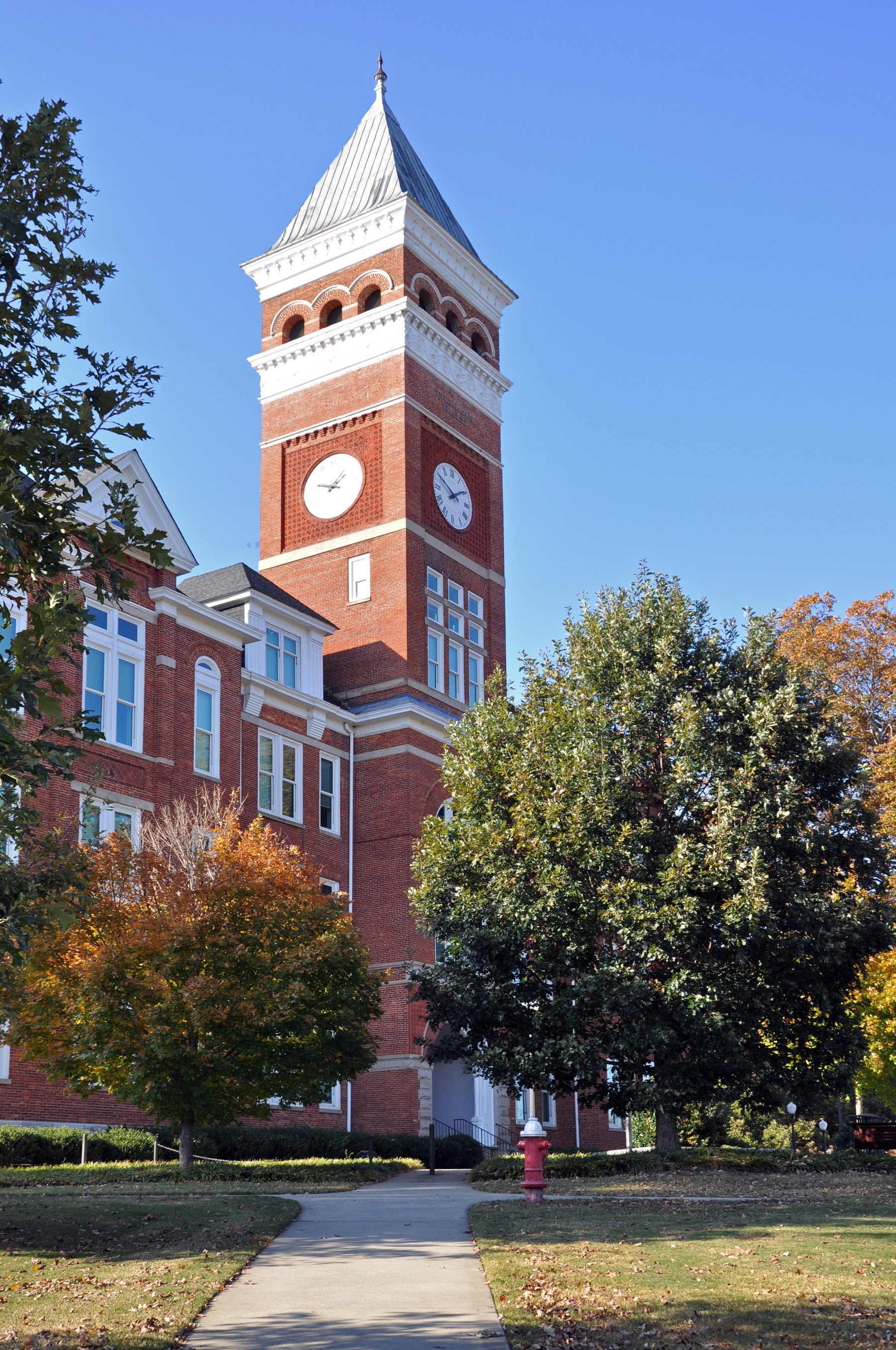 Tillman Hall clock tower at Clemson University against a blue sky