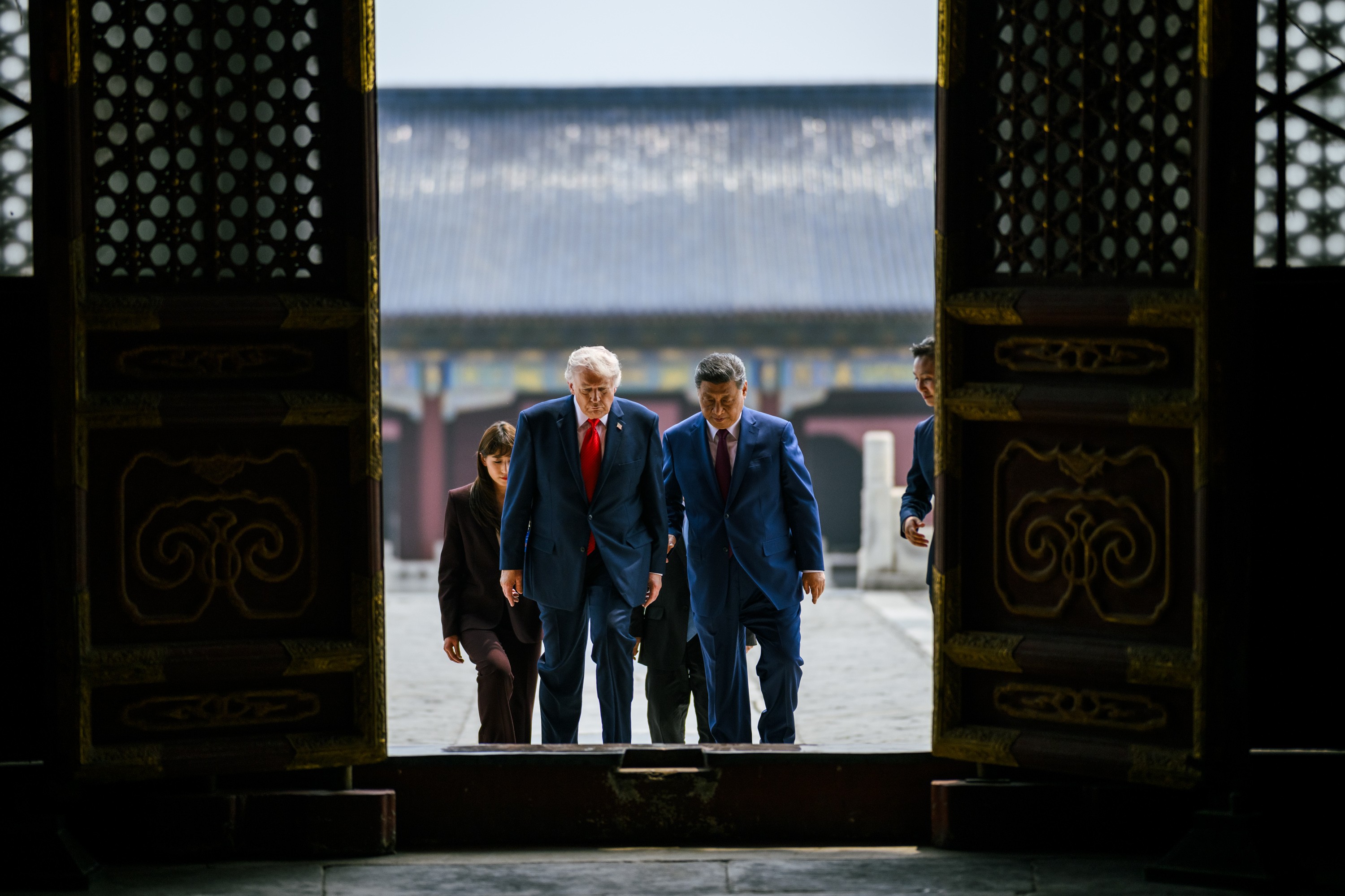 President Trump and Chinese leader Xi Jinping walk together through a gate at the Temple of Heaven in Beijing during their May 2026 summit