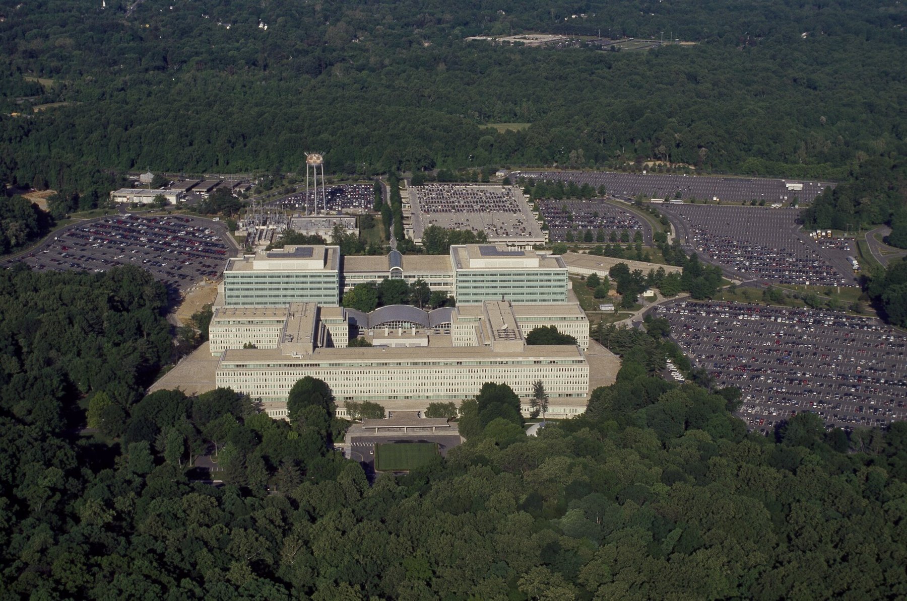 Aerial view of CIA headquarters in Langley, Virginia, surrounded by forest and parking lots
