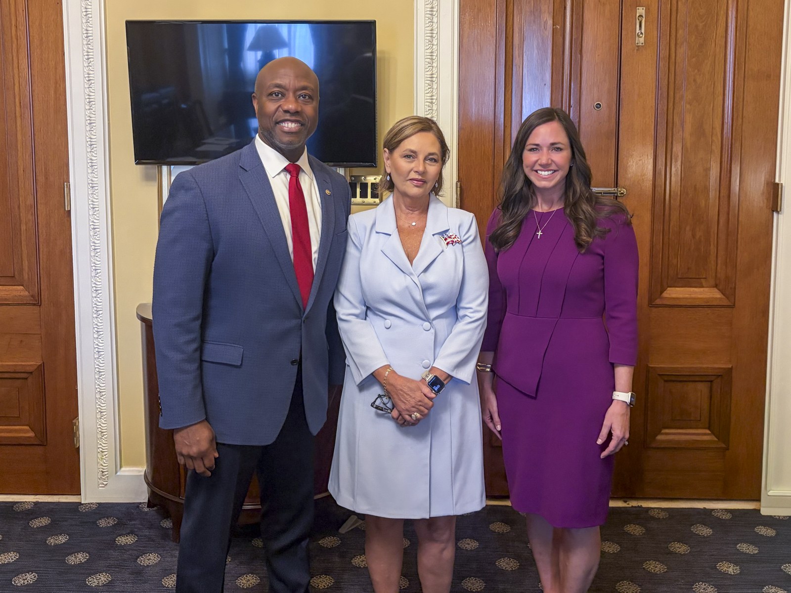 Sen. Tim Scott, Sen. Darline Graham, and Sen. Katie Britt standing together at the US Capitol before Graham's swearing-in