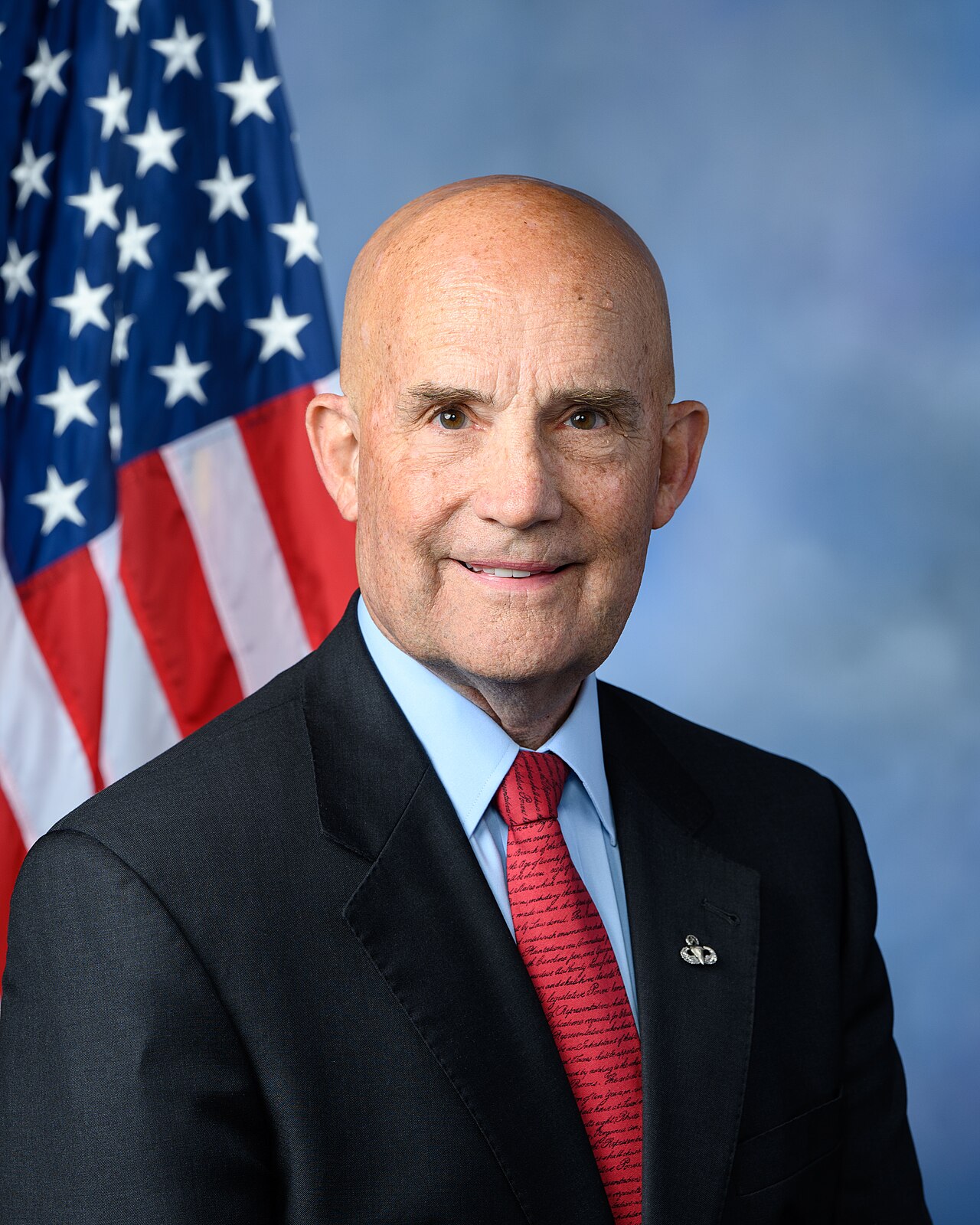 Official portrait of Rep. Keith Self of Texas in front of an American flag