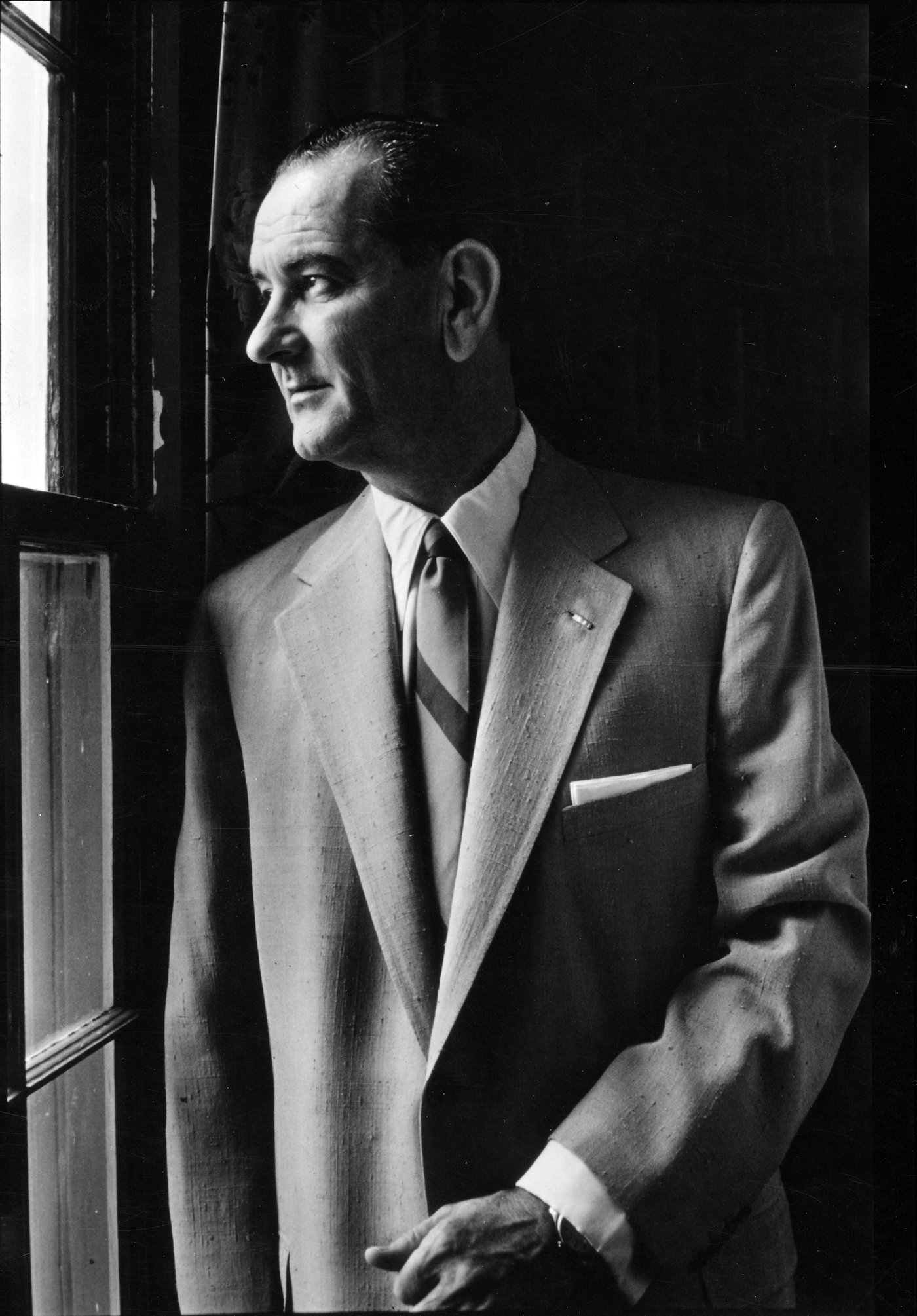 Senator Lyndon B. Johnson in a 1955 portrait, looking out a window