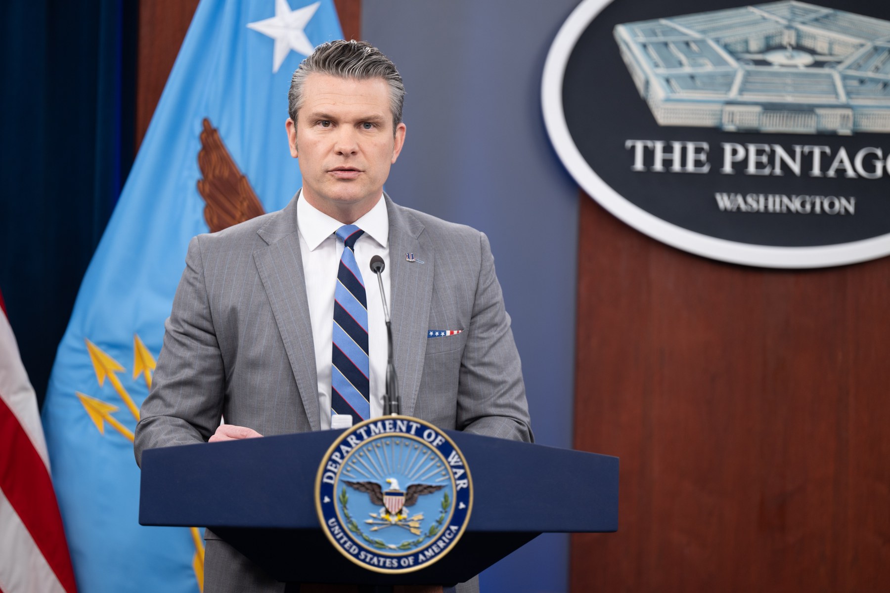 Defense Secretary Pete Hegseth speaks at a Department of War podium during a Pentagon press briefing on April 24, 2026