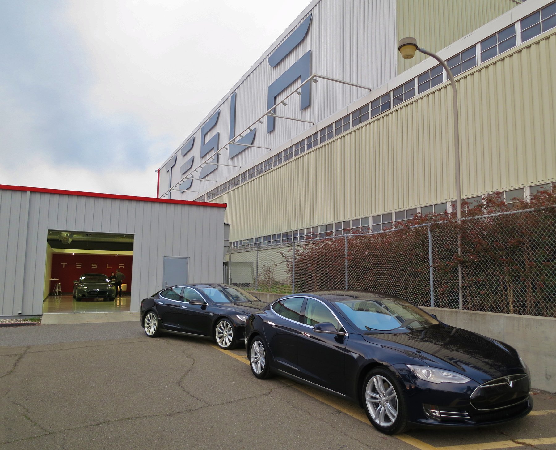 New Tesla Model S sedans parked outside Tesla's Fremont, California factory