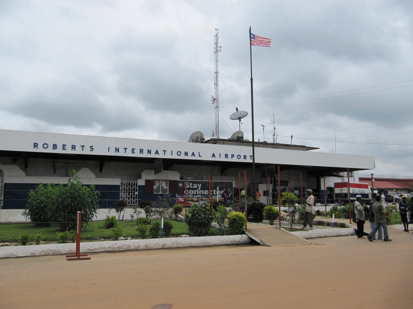 The terminal at Roberts International Airport outside Monrovia, Liberia, with the Liberian flag flying above it
