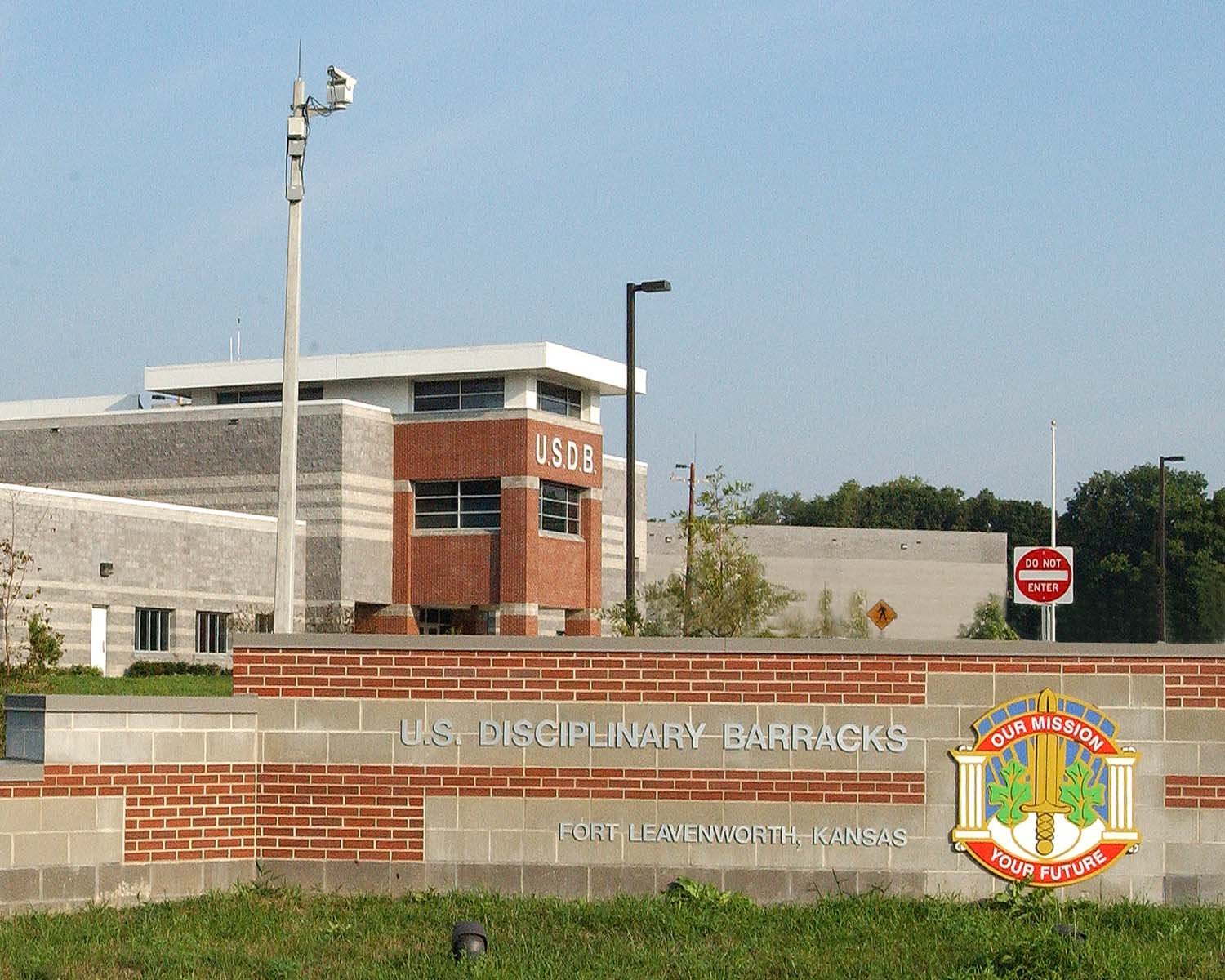 Entrance sign and building of the U.S. Disciplinary Barracks at Fort Leavenworth, Kansas