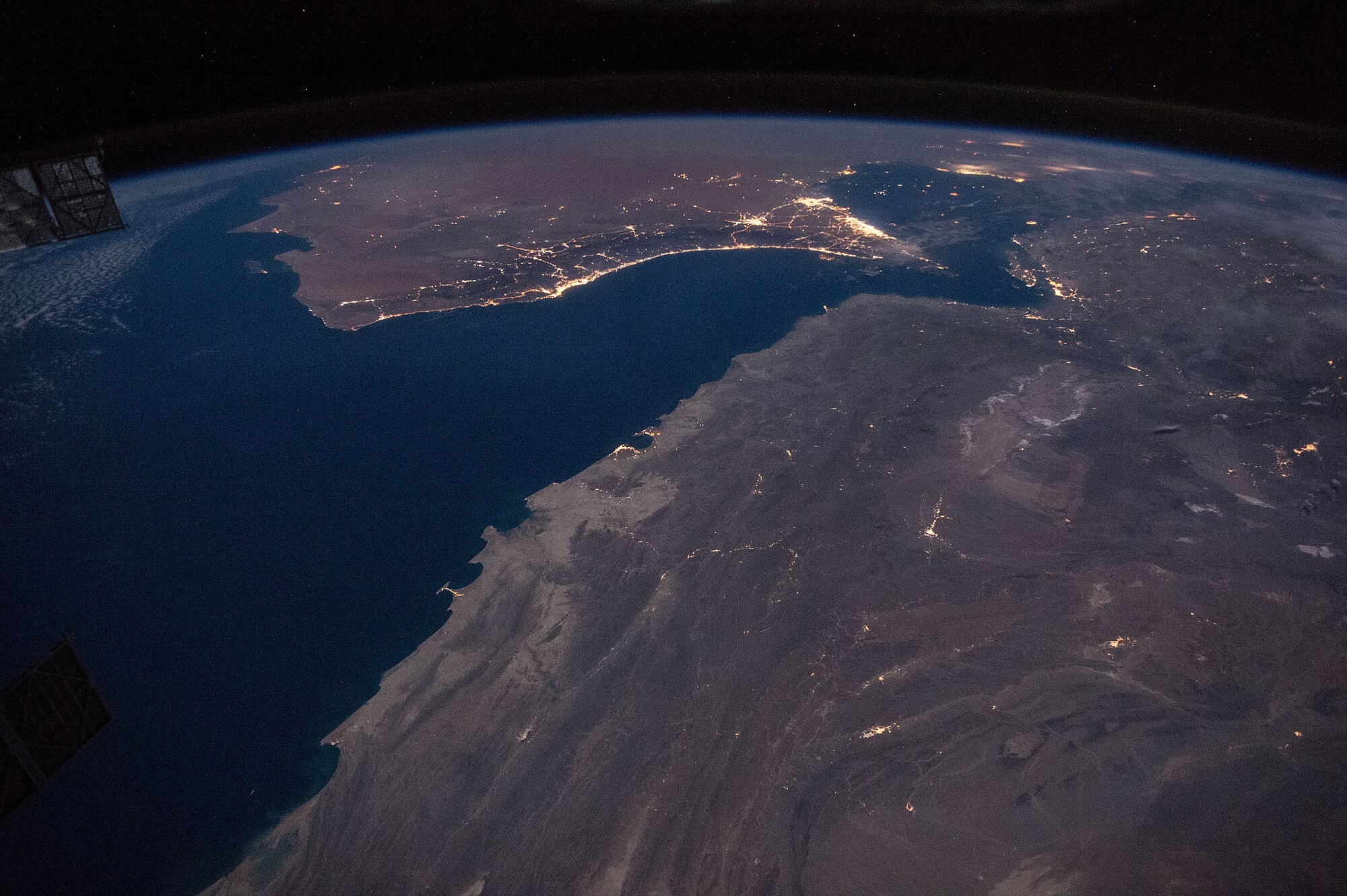 Night view from the International Space Station of the Gulf of Oman, the Strait of Hormuz and the Persian Gulf coast