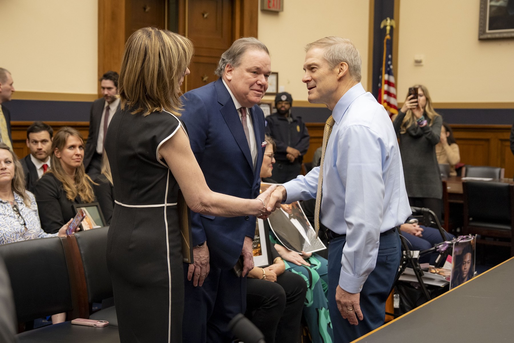 House Judiciary Committee Chairman Jim Jordan greeting witnesses at a committee hearing in the Rayburn House Office Building