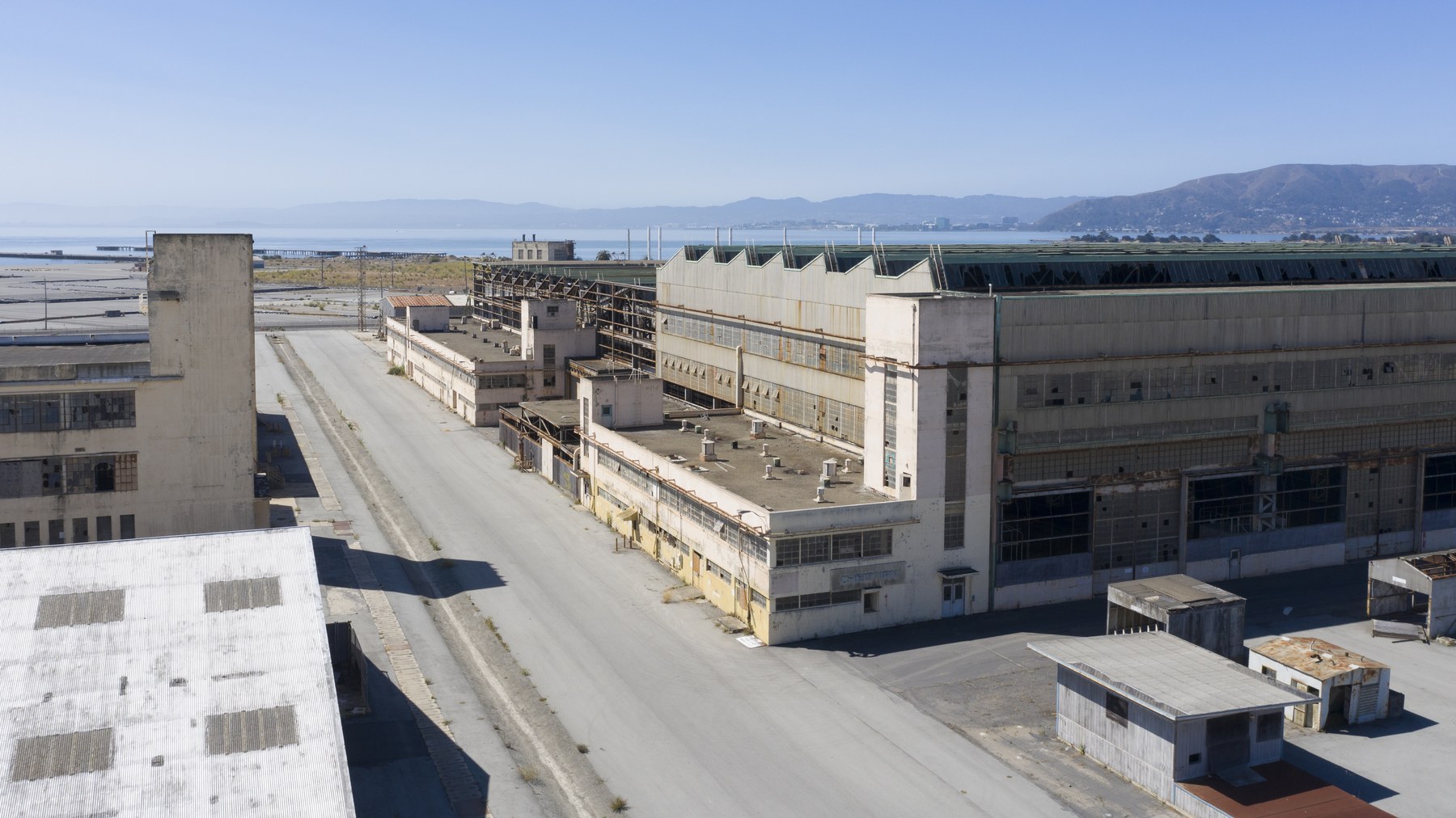 Rows of abandoned industrial buildings at the former Hunters Point Naval Shipyard in San Francisco