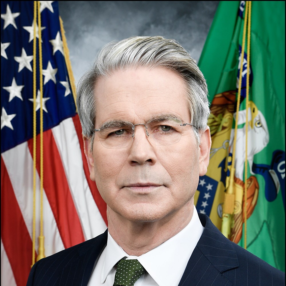 Official portrait of Treasury Secretary Scott Bessent in front of the American flag and the Treasury flag