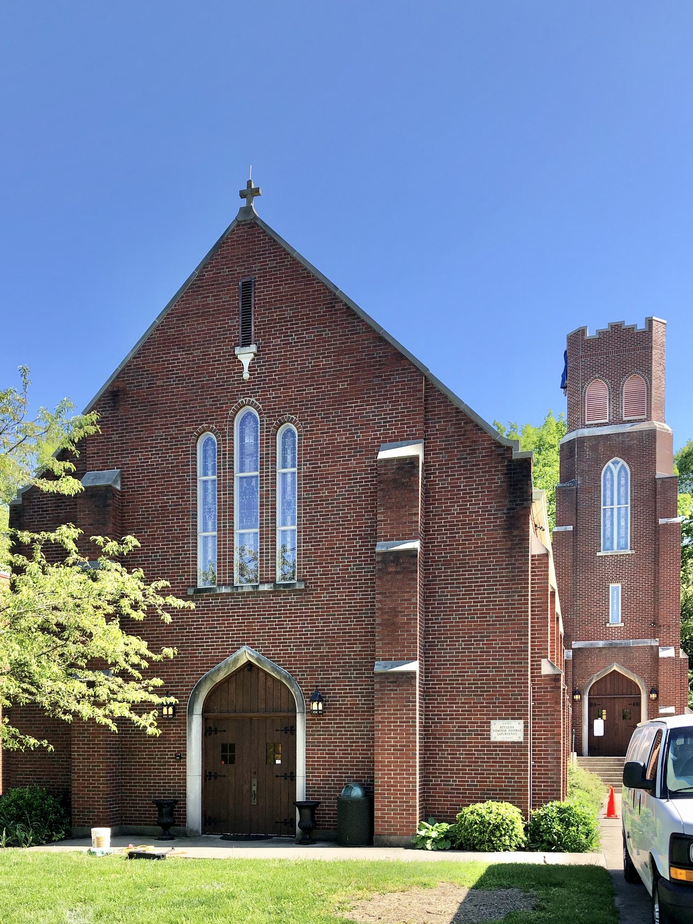 Front facade and bell tower of Our Lady of Lourdes Catholic church in Park Hills, Kentucky