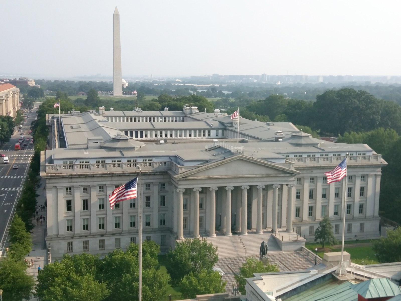 The U.S. Treasury Department building in Washington, D.C., with the Washington Monument in the background