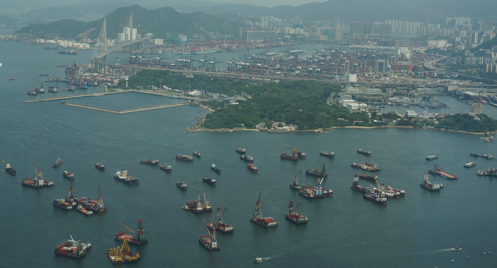 Aerial view of the Kwai Tsing container terminals and cargo barges in Hong Kong harbour