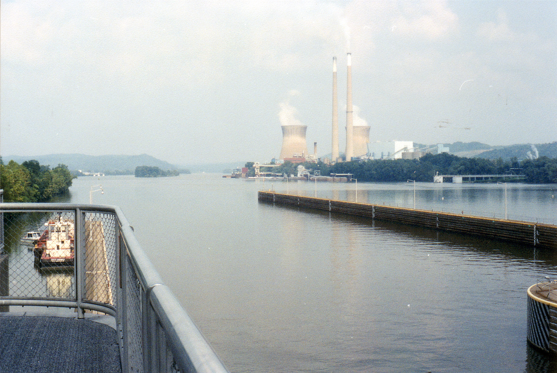 Coal-fired power plant with cooling towers and smokestacks on the Ohio River in Pleasants County, West Virginia