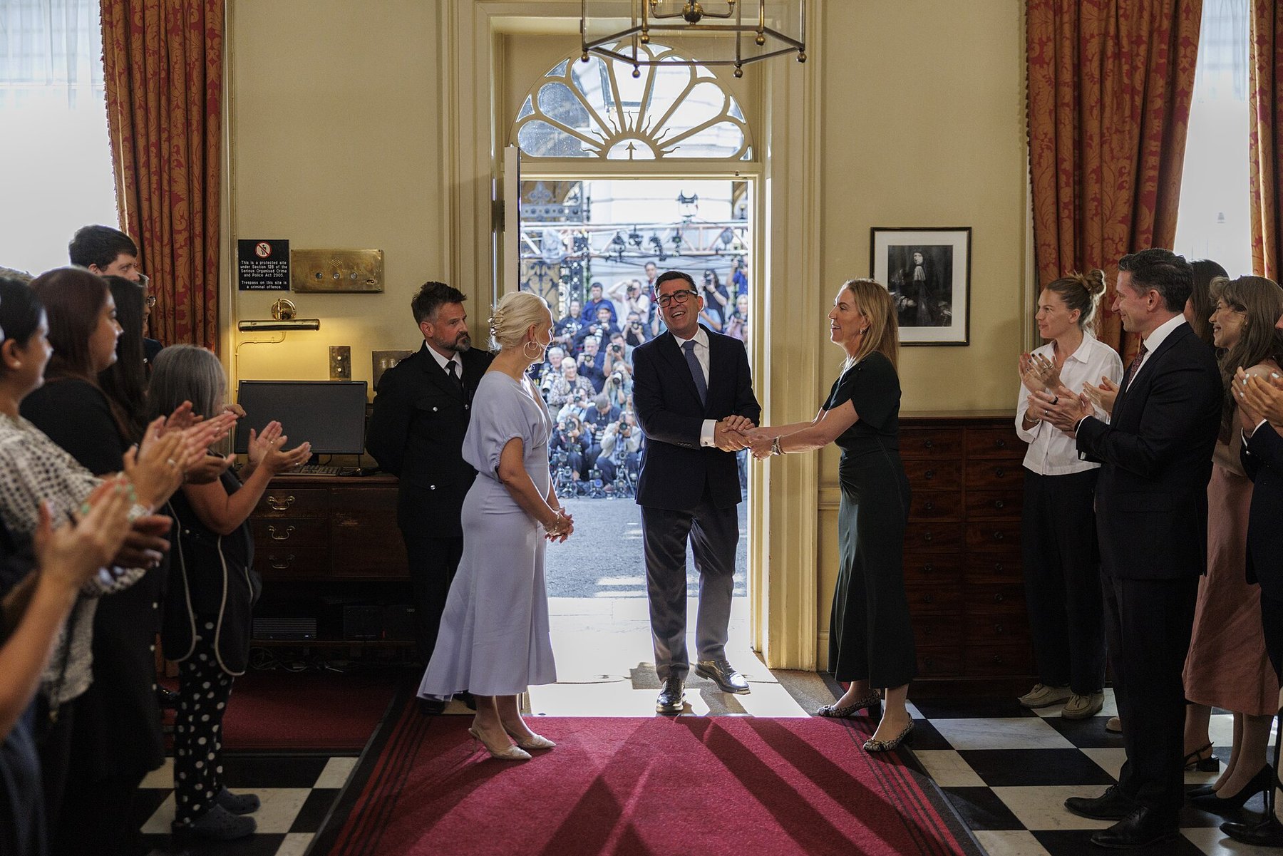 British Prime Minister Andy Burnham arriving inside 10 Downing Street as staff applaud