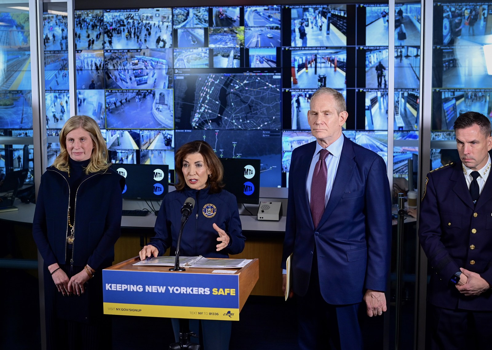 New York Gov. Kathy Hochul speaks at a podium marked Keeping New Yorkers Safe at MTA headquarters