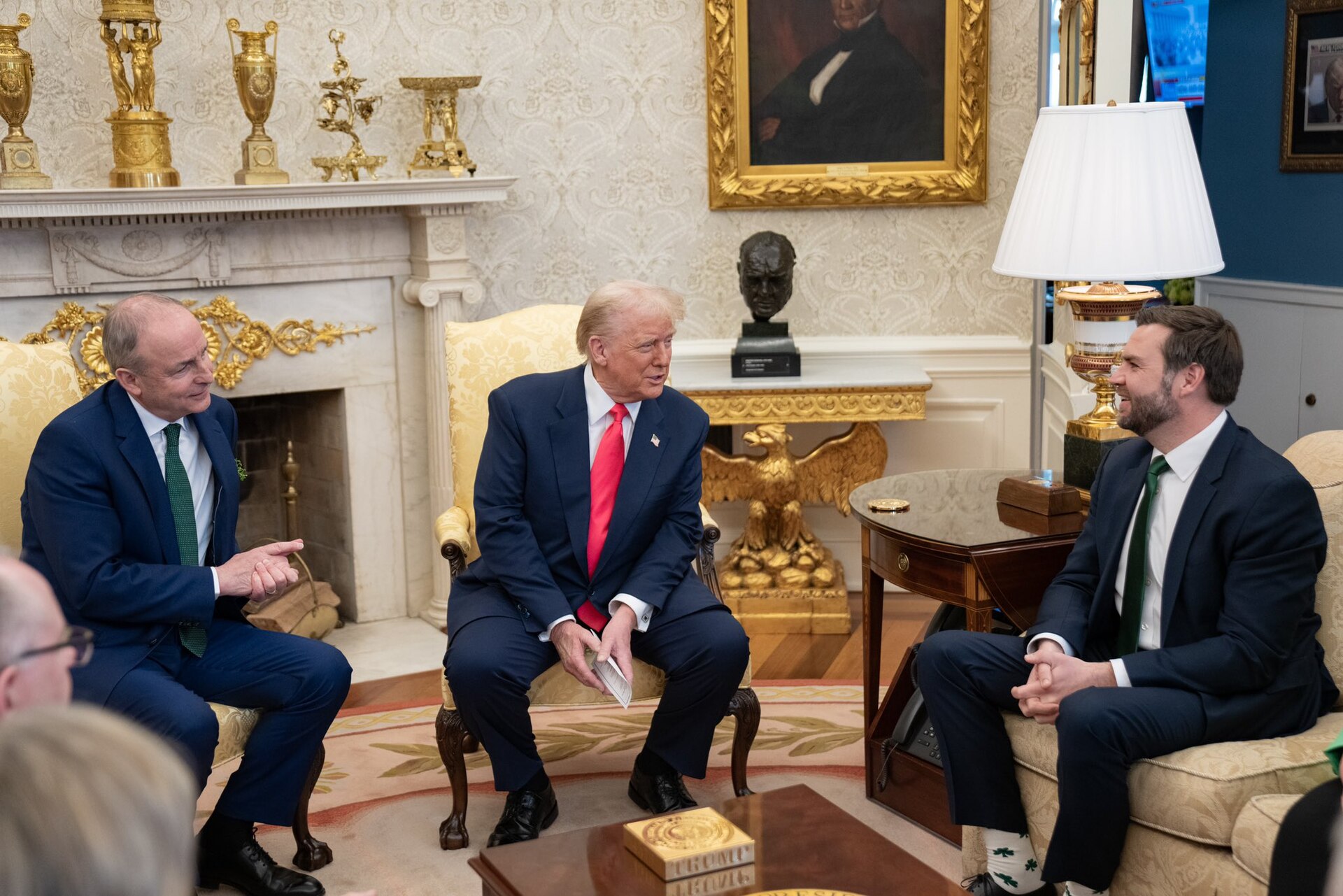 President Trump seated in the Oval Office beside Vice President JD Vance during a meeting