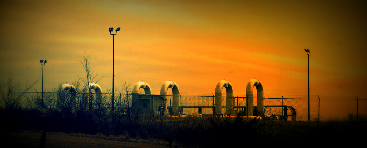 Keystone oil pipeline pumping station and infrastructure at sunset
