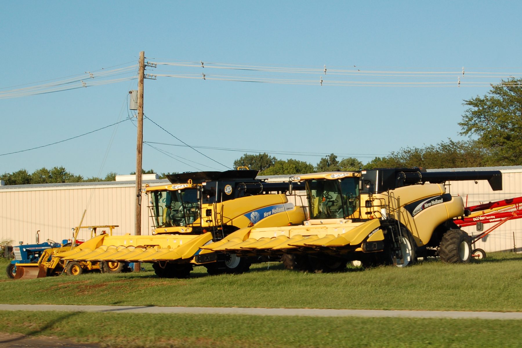 Two New Holland combine harvesters with corn headers parked in Beatrice, Nebraska