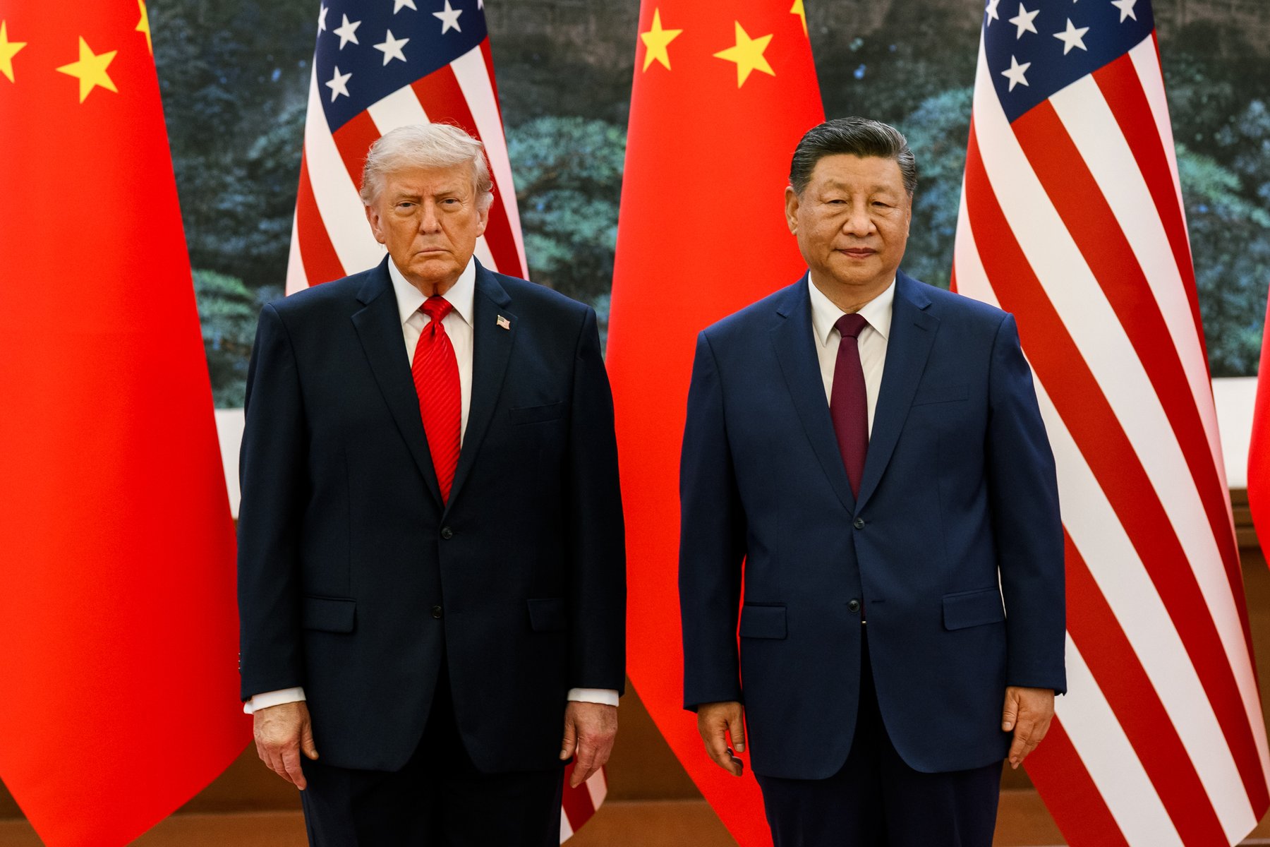 President Trump and Xi Jinping stand before American and Chinese flags at a welcome ceremony in the Great Hall of the People, Beijing, May 14, 2026