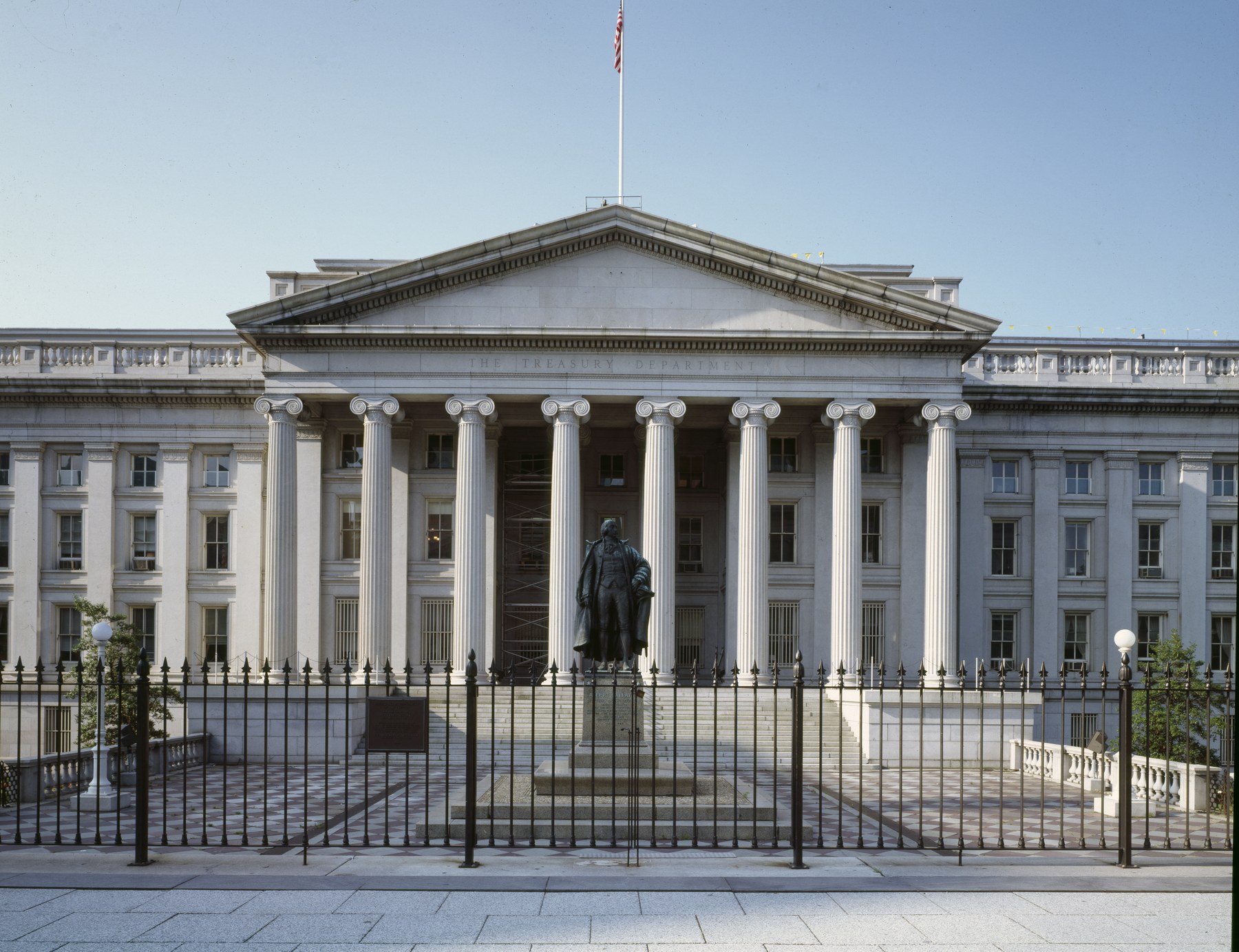 The U.S. Treasury Department building on Pennsylvania Avenue in Washington, with the Albert Gallatin statue standing in front