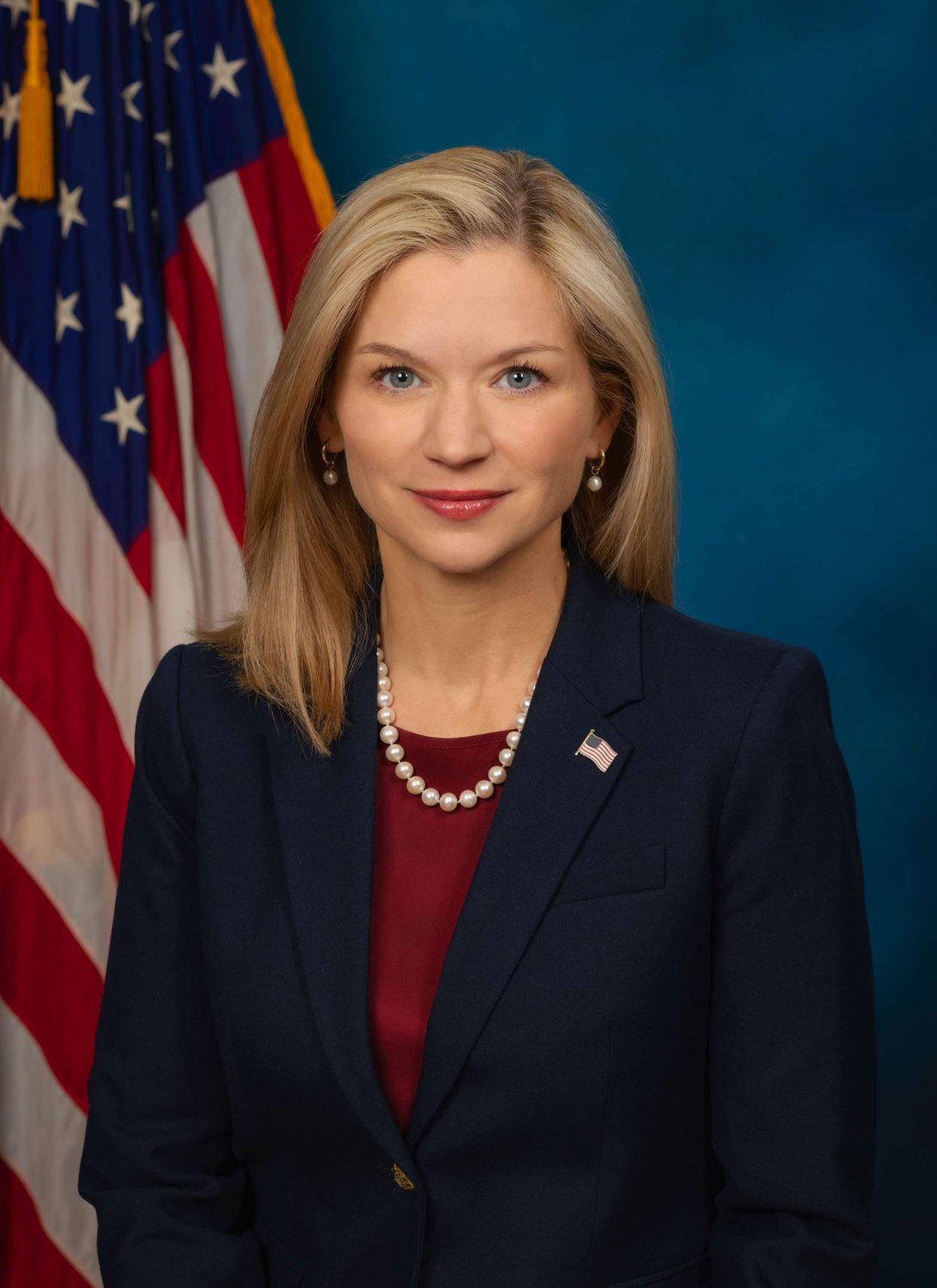 Official portrait of U.S. Attorney for the District of Utah Melissa Holyoak in front of an American flag