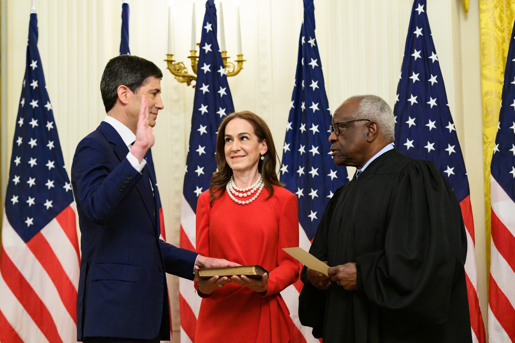 Kevin Warsh takes the oath of office as Federal Reserve chairman from Supreme Court Justice Clarence Thomas at the White House on May 22, 2026, with his wife holding the Bible
