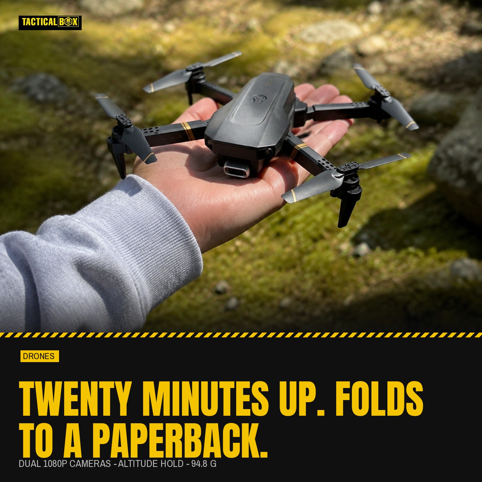 TacRight RC Drone held on an open palm in a mossy clearing with the flight-time figures alongside