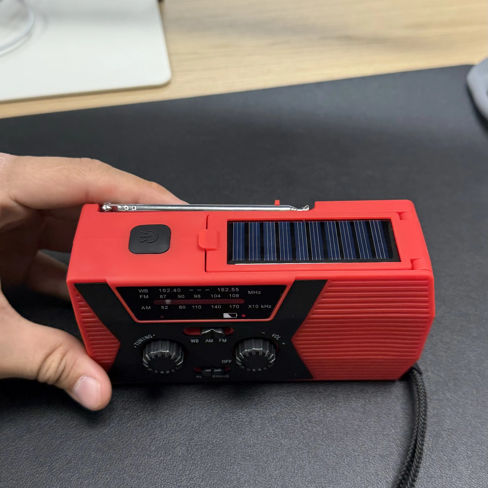 Close-up of the solar panel and telescopic antenna on the Tacright Emergency Radio