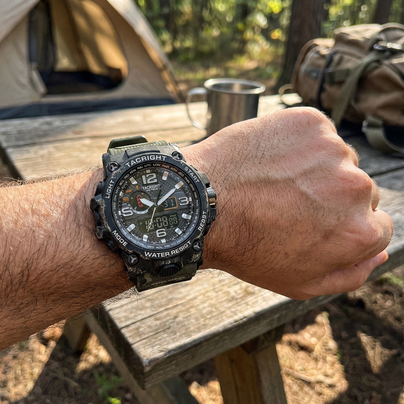 The Tacright Military Watch worn at a campsite beside a tent and pack