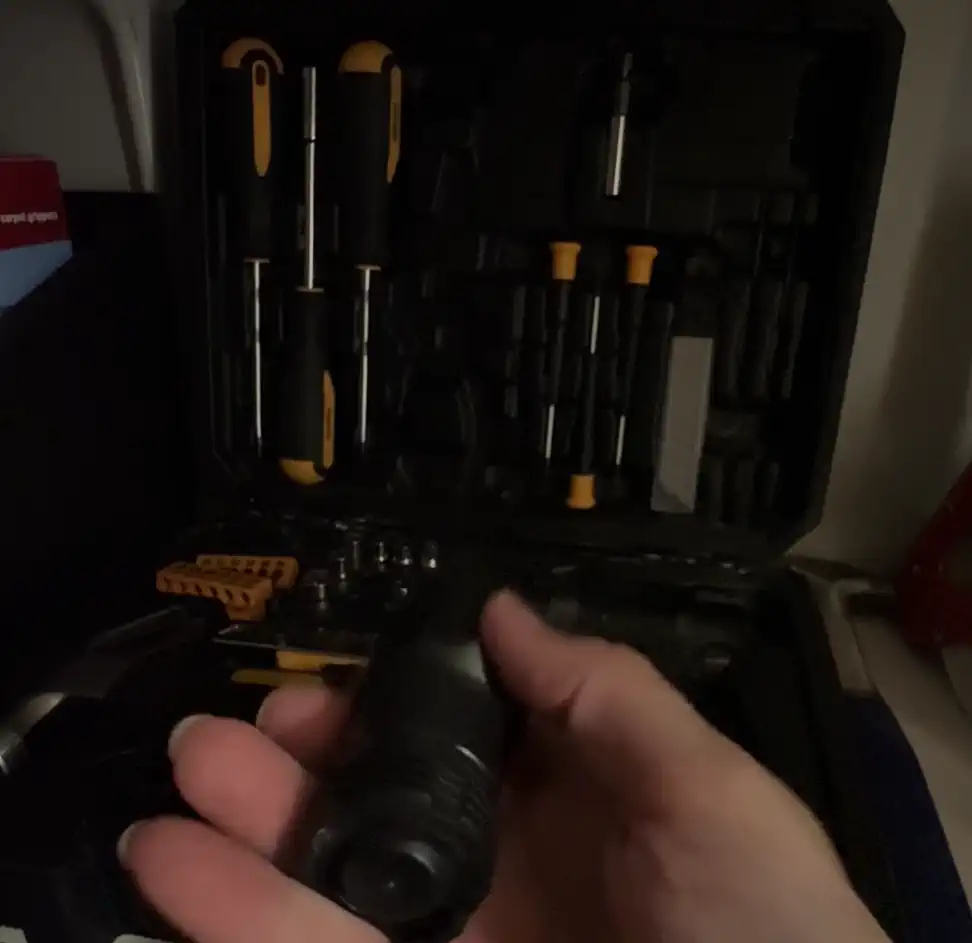 High-lumen tactical flashlight in use — searchbeam down a dark trail