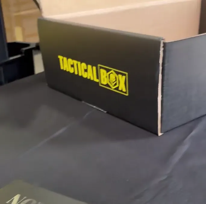 Rows of TacticalBox packages being prepared in a warehouse