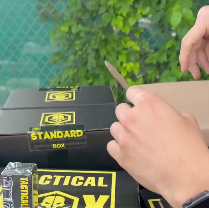 Reaching into a Tactical Box shipment, flashlight visible
