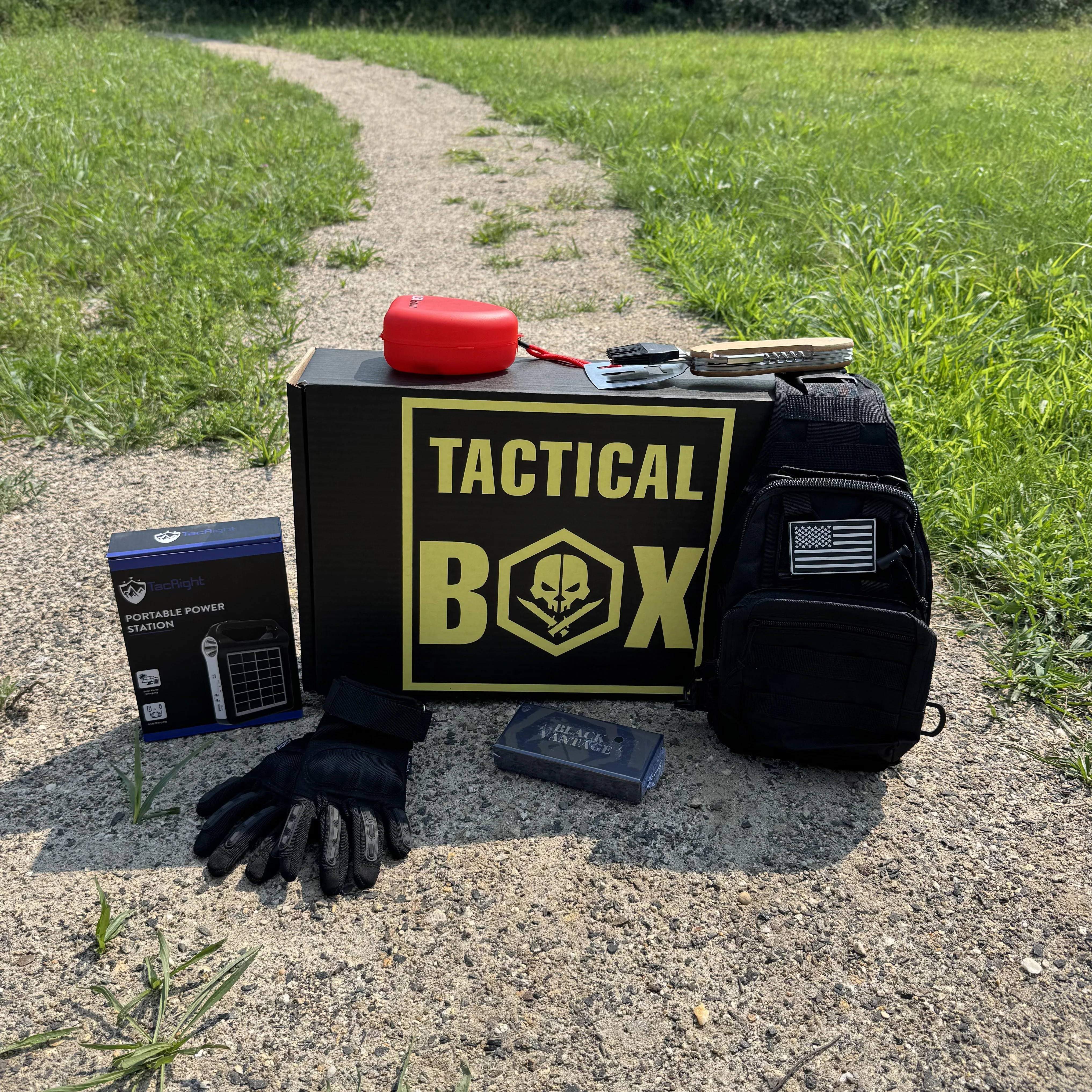 An open TacticalBox Welcome Box showing its starter gear contents